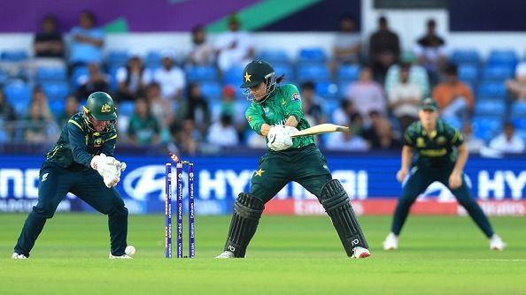 Iram Javed (centre) is bowled out by Australia's Georgia Wareham