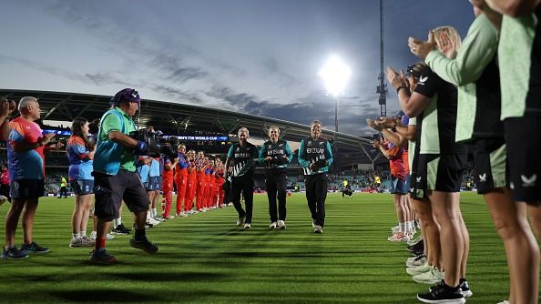 Suzie Bates, Sophie Devine and Lea Tahuhu of New Zealand receives the guard of honour