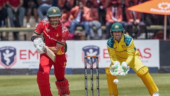 Zimbabwe's Craig Ervine (L) plays a shot