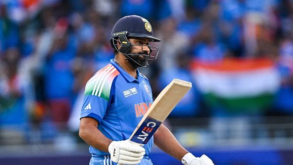 Rohit Sharma celebrates after scoring a half-century (50 runs) during the ICC Champions Trophy one-day international (ODI) final cricket match between India and New Zealand