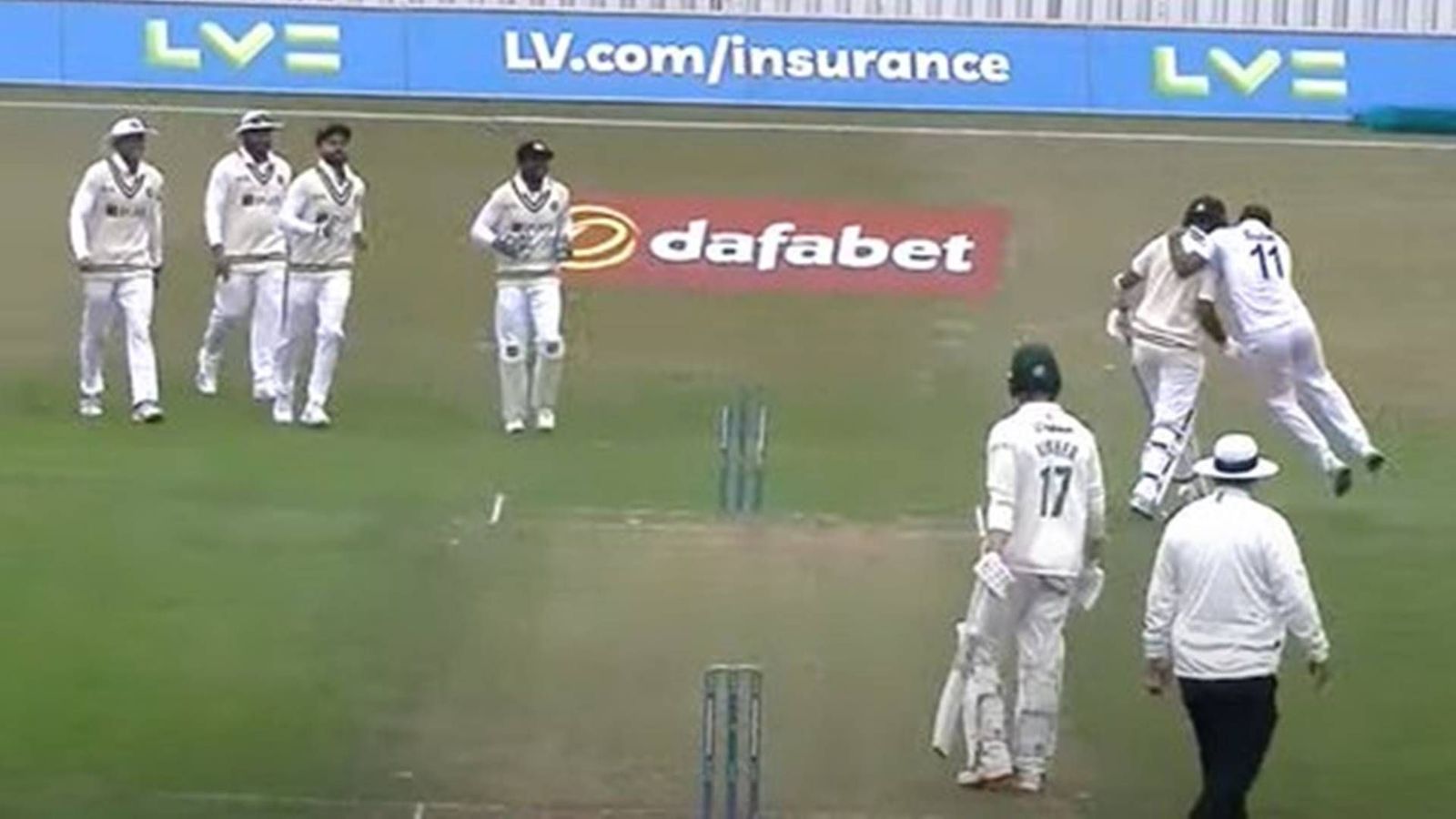 Mohammed Shami knocks over Cheteshwar Pujara's stumps, then jumps on him to celebrate the wicket Mohammed Shami knocks over Cheteshwar Pujara's stumps, then jumps on him to celebrate the wicket