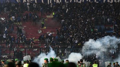 Football match in Indonesia turns violent as fans storm the pitch: Over 175 people feared dead and many more injured SportsTak