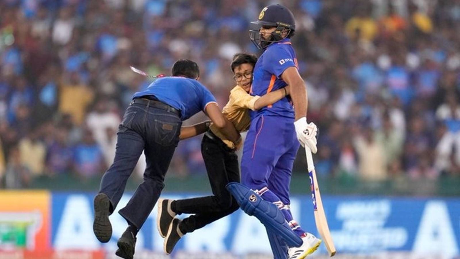 Watch: Rohit Sharma almost gets knocked over by security personnel attempting to tackle young intruder Watch: Rohit Sharma almost gets knocked over by security personnel attempting to tackle young intruder