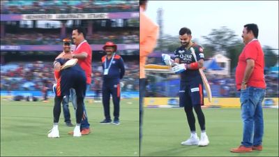 Virat Kohli touches childhood coach Rajkumar Sharma's feet before Delhi Capitals clash, video goes viral SportsTak
