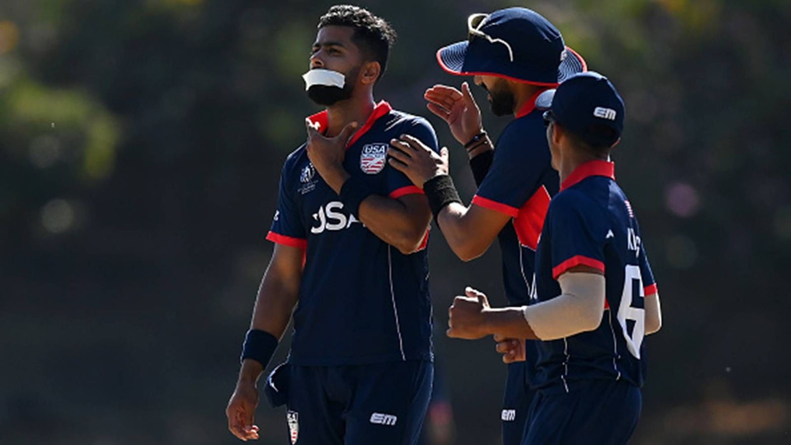 Watch: Back in side after two-match ban from ICC, USA bowler Ali Khan celebrates wicket with tape on mouth Watch: Back in side after two-match ban from ICC, USA bowler Ali Khan celebrates wicket with tape on mouth