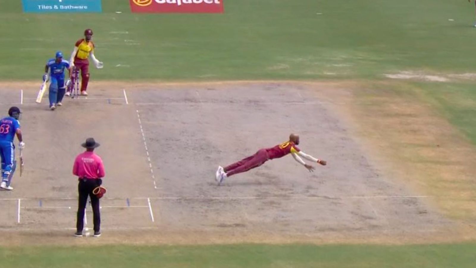 Watch: Roston Chase stuns Tilak Varma with acrobatic return catch; video goes viral Watch: Roston Chase stuns Tilak Varma with acrobatic return catch; video goes viral