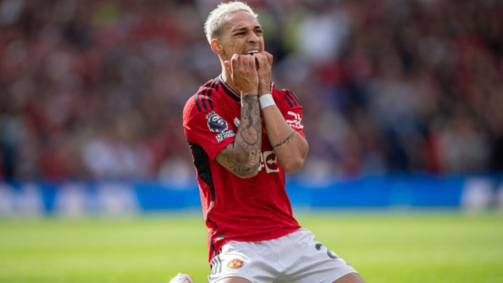 Manchester United's Antony returns to training amidst allegations, club shows support Antony of Manchester United bites his fingers in frustration after missing a goal scoring opportunity during the Premier League match between Manchester United and Nottingham Forest at Old Trafford on August 26, 2023 in Manchester, England.