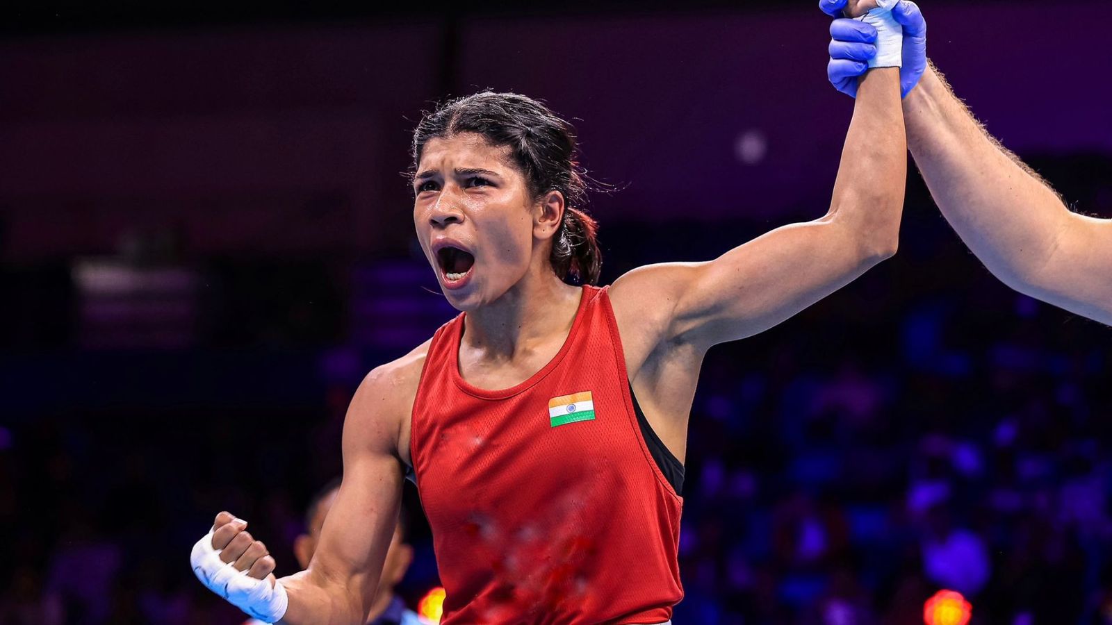 Nikhat Zareen shines at Asian Games 2023, secures spot for Paris Olympics 2024 Indian boxer Nikhat Zareen (50kg) after win Boxing match with vs Chuthamat Raksat of Thailand during the IBA organised women world boxing championship at IG Stadium in New Delhi, India On Wednesday, March 22, 2023.