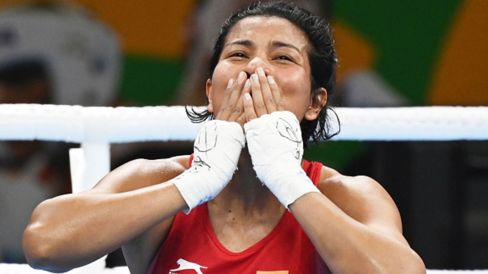 In quest of Olympic berth, Lovlina Borgohain shines bright and confirmed of medal in Asian Games 2023 Indian Boxer Lovlina Borgohain reacts after winning her 70-75kg- (Light Flyweight) category semifinals match against Chinese boxer Li Qian at the 2023 IBA Women's Boxing World Championships on March 23, 2023 in New Delhi, India.