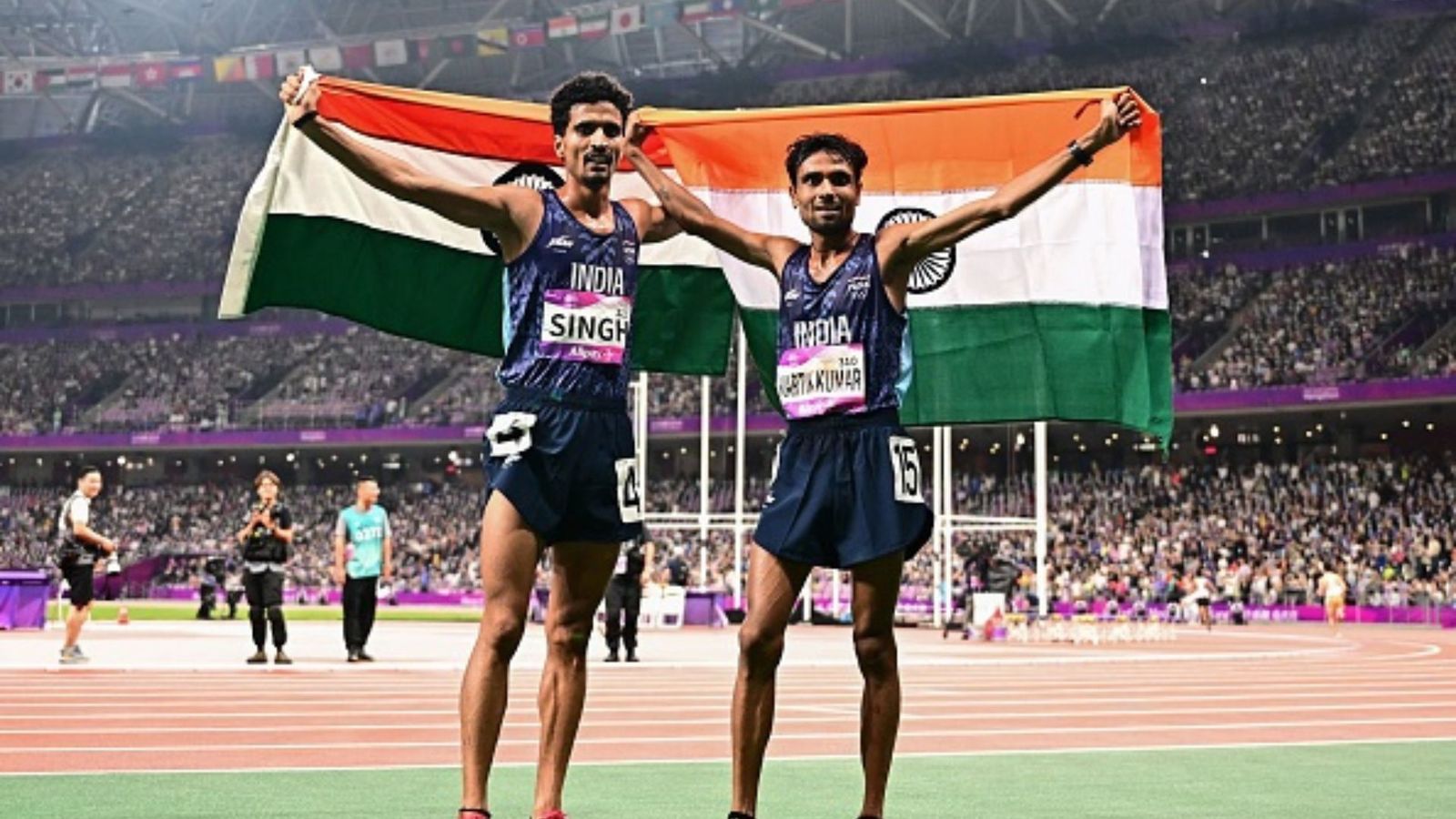 Asian Games 2023: Kartik Kumar wins silver, Gulveer Singh clinches bronze in 10,000m race Silver medallist India's Kartik Kumar (R) and bronze medallist India's Gulveer Singh celebrate after the men's 10,000m final athletics event during the 2022 Asian Games in Hangzhou in China's eastern Zhejiang province on September 30, 2023.
