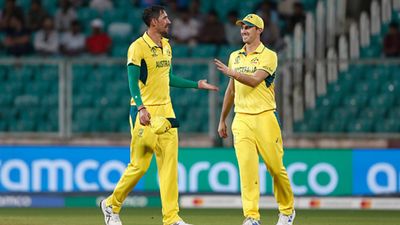World Cup warm-up matches: Australia robbed of an easy win over Netherlands as rain plays spoilsport after Starc's hat-trick Mitchell Starc celebrates a wicket with Pat Cummins (Getty Images)