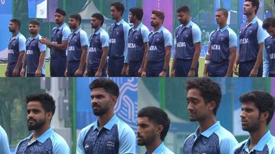 'I was emotional seeing it': Dinesh Karthik pens heartfelt post after debutant 26-year-old Indian bowler shed tears during national anthem; watch video Indian cricket players during national anthem at the 2023 Asian Games.