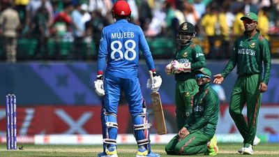 Afghanistan suffer massive batting collapse as Bangladesh make a statement with easy 6-wicket win in their World Cup 2023 opener Mujeeb Ur Rahman and Bangladesh players (Getty Images)