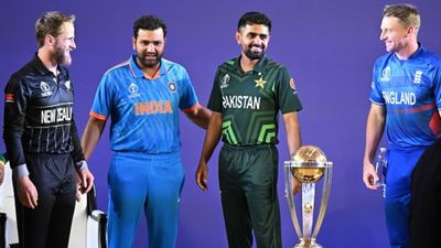 EXCLUSIVE: World Cup winner Suresh Raina backs India to win trophy on home soil once again India's captain Rohit Sharma (2L) with his counterparts New Zealand's Kane Williamson (L), Pakistan's Babar Azam (2R) and England's Jos Buttler speak as they stand beside the trophy during the Captains' Day event, an interaction session with the media at