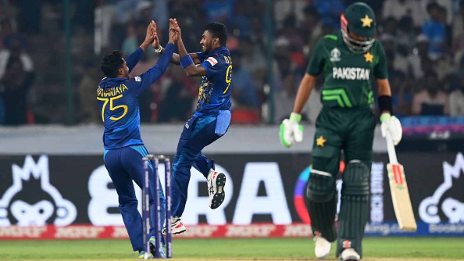 'Babar isn't even 1% of Virat Kohli': Fans lose cool on Pakistan skipper after yet another poor ODI World Cup showing Dilshan Madushanka of Sri Lanka celebrates the wicket of Babar Azam of Pakistan during the ICC Men's Cricket World Cup India 2023 between Pakistan and Sri Lanka at Rajiv Gandhi International Stadium on October 10, 2023 in Hyderabad, India.
