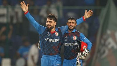'He repaid my faith' — After win over England, Hashmatullah Shahidi heaps credit on one player and it's NOT Rashid Khan! Rashid Khan of Afghanistan celebrates the wicket of Mark Wood of England with team mate Ikram Alikhil to win by 69 runs during the ODI World Cup match between England and Afghanistan