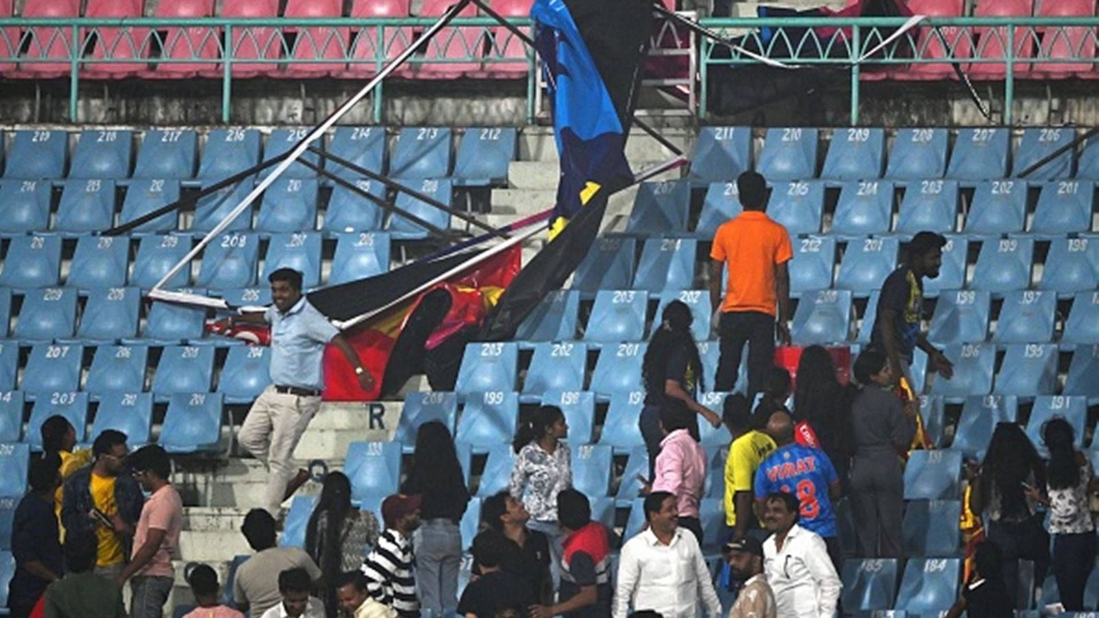 Watch: Hoardings fall, spectators run for cover at Ekana Stadium during Australia vs Sri Lanka match due to bad weather Watch: Hoardings fall, spectators run for cover at Ekana Stadium during Australia vs Sri Lanka match due to bad weather