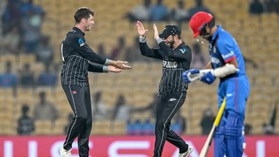 NZ vs AFG: New Zealand's unbeaten run in World Cup continues, bulldoze Afghanistan by 149 runs to notch 4th victory New Zealand's Mitchell Santner (L) celebrates with teammate after taking the wicket of Afghanistan's Fazalhaq Farooqi during the 2023 ICC Men's Cricket World Cup one-day international (ODI) match between New Zealand and Afghanistan at the MA Chidambaram