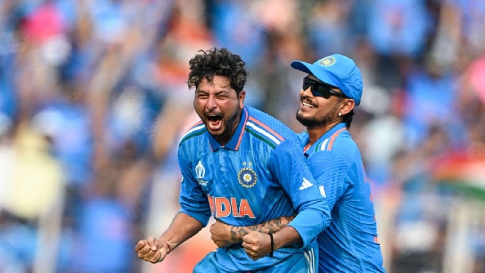 ODI World Cup: Kuldeep Yadav namedrops 2 players for playing a massive role in Indian spinners' success India's Kuldeep Yadav (L) celebrates with teammate Ishan Kishan after taking the wicket of Pakistan's Saud Shakeel during the 2023 ICC Men's Cricket World Cup one-day international (ODI) match between India and Pakistan at the Narendra Modi Stadium in
