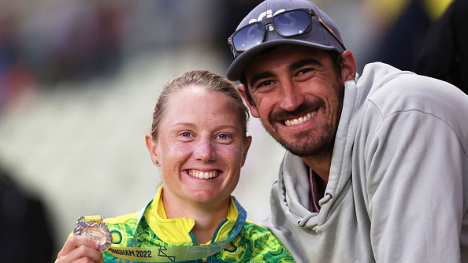 Alyssa Healy undergoes urgent surgery after suffering brutal injury while attempting to stop her dogs from fighting Alyssa Healy of Team Australia poses alongside Mitchell Starc after being presented with a Gold Medal during the Cricket T20 - Gold Medal match between Team Australia and Team India on day ten of the Birmingham 2022 Commonwealth Games