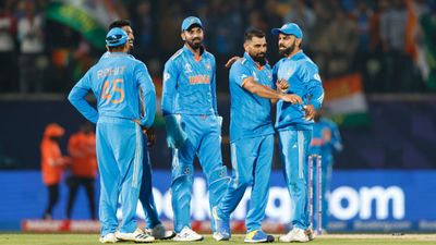 'No way India isn't winning the World Cup:' Shoaib Akhtar makes another big statement Indian cricket team members celebrate during a World Cup 2023 game. (Getty Images)