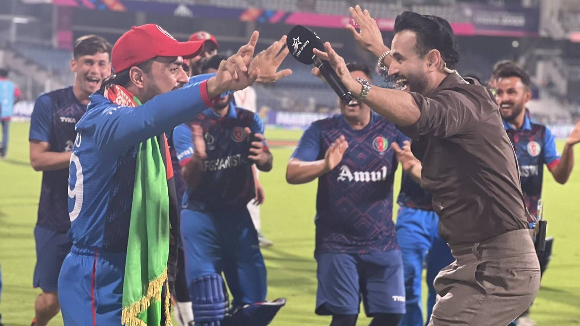 Rashid Khan halts 'lap of honour' midway to dance with Irfan Pathan after historic win over Pakistan, watch viral video Rashid Khan halts 'lap of honour' midway to dance with Irfan Pathan after historic win over Pakistan, watch viral video