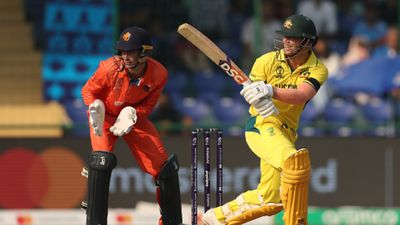 AUS vs NED: Why Australian players are sporting black armbands in World Cup clash against Netherlands David Warner of Australia plays a shot as Scott Edwards of Netherlands keeps during the ICC Men's Cricket World Cup India 2023 between Australia and Netherlands at Arun Jaitley Stadium on October 25, 2023 in Delhi, India.