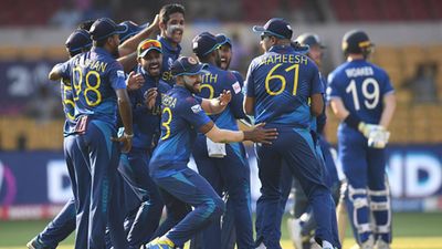 ENG vs SL: Sri Lanka stun defending champions England with 8-wicket win in Bengaluru after bowling them out for 156 Sri Lankan players celebrate Chris Woakes' wicket (Getty Images)