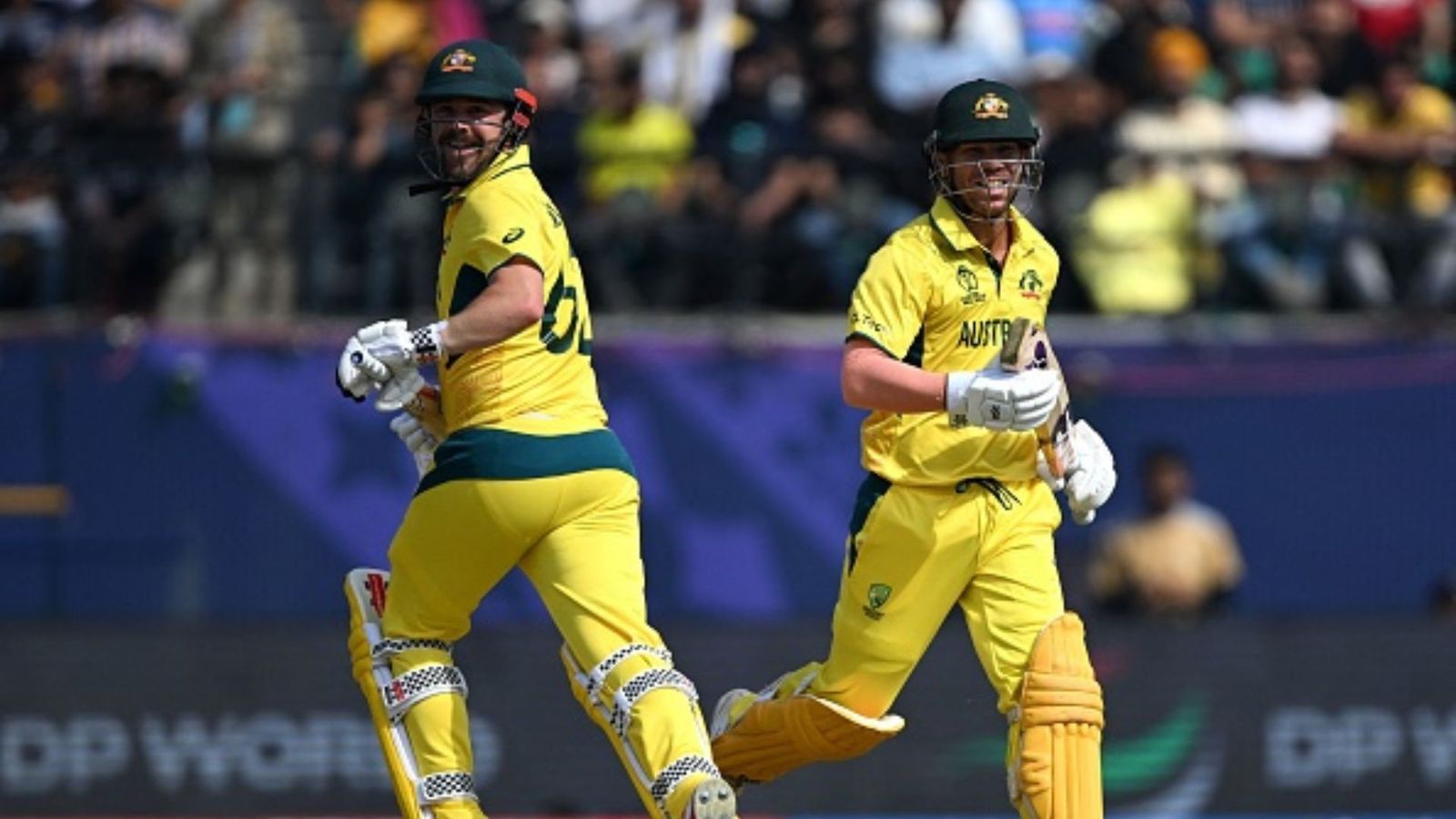 ODI World Cup: Australia achieve historic feat with three consecutive 350-plus totals in ODIs Australia's Travis Head (L) and David Warner run between the wickets during the 2023 ICC Men's Cricket World Cup one-day international (ODI) match between Australia and New Zealand.