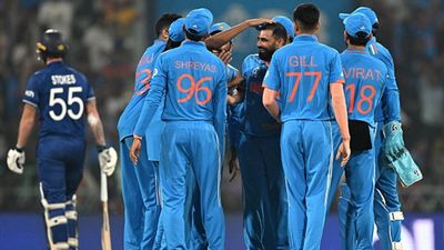 Pace battery-charged India book semi-final berth by knocking out defending champions England with massive 100-run win Mohammed Shami celebrates Ben Stokes' wicket with his teammates (Getty Images)
