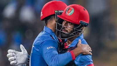 Afghanistan's complete performance almost knocks out 1996 World Champions Sri Lanka with dominant 7-wicket win Skipper Hashmatullah Shahidi hugs his teammate Azmatullah Omarzai