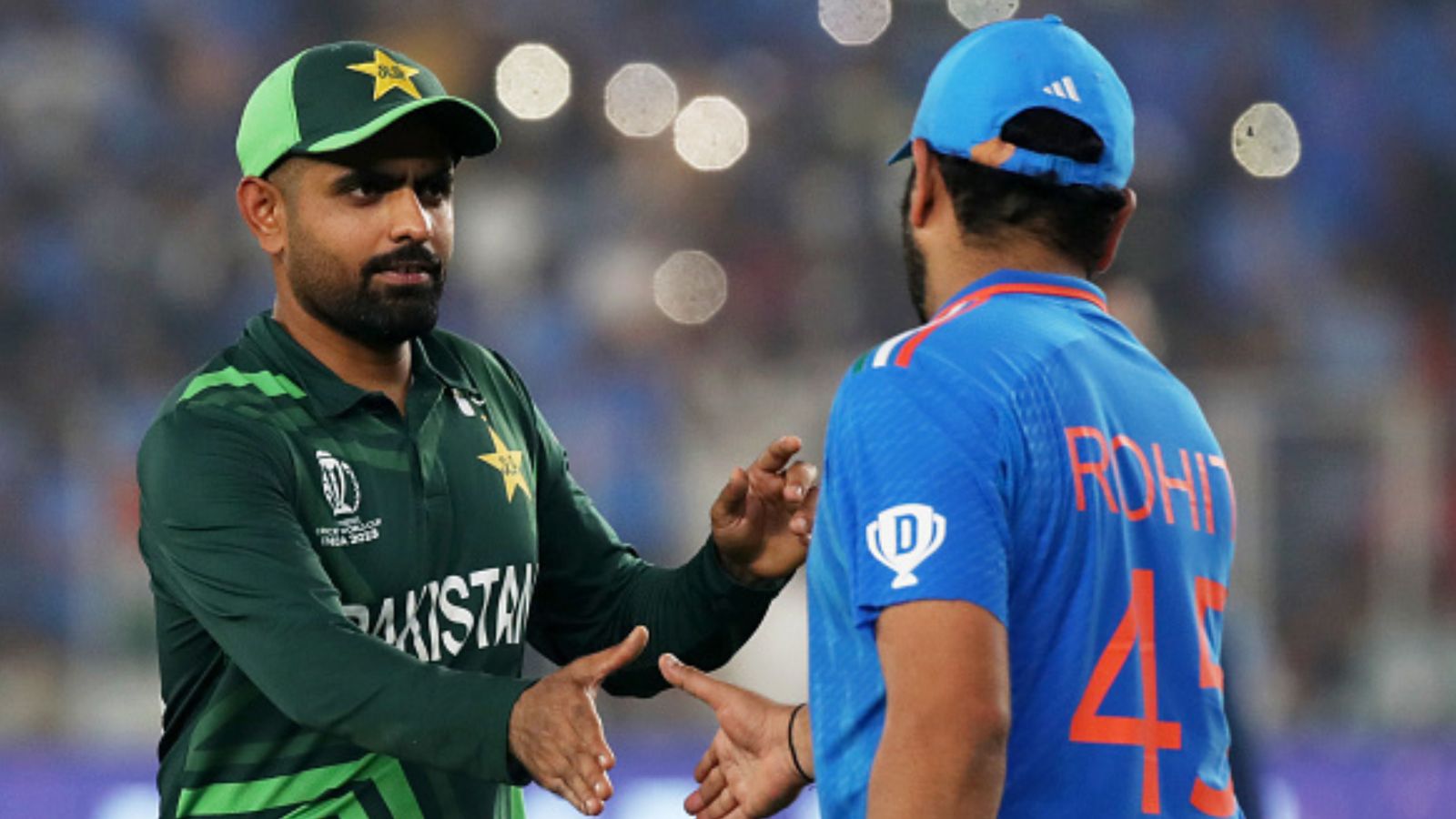 'Pakistan can beat India in World Cup semi final': Imad Wasim makes sensational claim amid Babar army's flop show Pakistan skipper Babar Azam (left) shakes hand with Team India captain Rohit Sharma in this frame. (Getty)