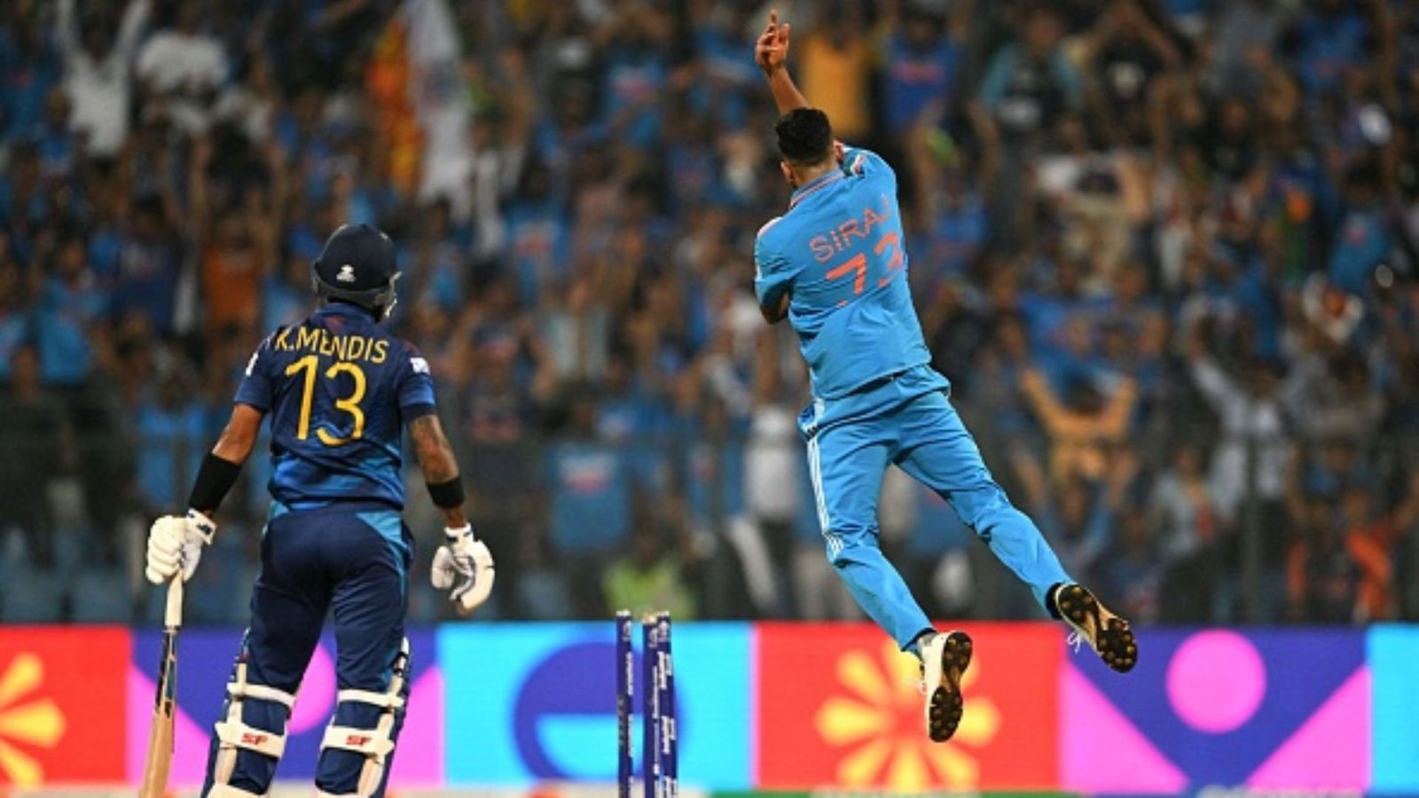 Sri Lankan Cricket in turmoil after 302-run loss to India; Board seeks 'urgent' answers from coaching staff, selectors India's Mohammed Siraj (R) celebrates after taking the wicket of Sri Lanka's captain Kusal Mendis during the 2023 ICC Men's Cricket World Cup one-day international (ODI) match between India and Sri Lanka at the Wankhede Stadium in Mumbai on November 2,