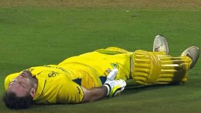 Tendulkar to Gambhir, cricket fraternity hails Glenn Maxwell who proved win predictor wrong with out-of-the-world 201 Glenn Maxwell lying on the ground after pulling his hamstring during 201-run knock (Screengrab: Hotstar)