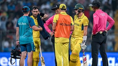 'He literally couldn't move': Pat Cummins reveals he signalled Adam Zampa to bat but physio's advice made Glenn Maxwell stay Glenn Maxwell and Pat Cummins in the ground after the former got some help from the physiotherapist (Getty Images)