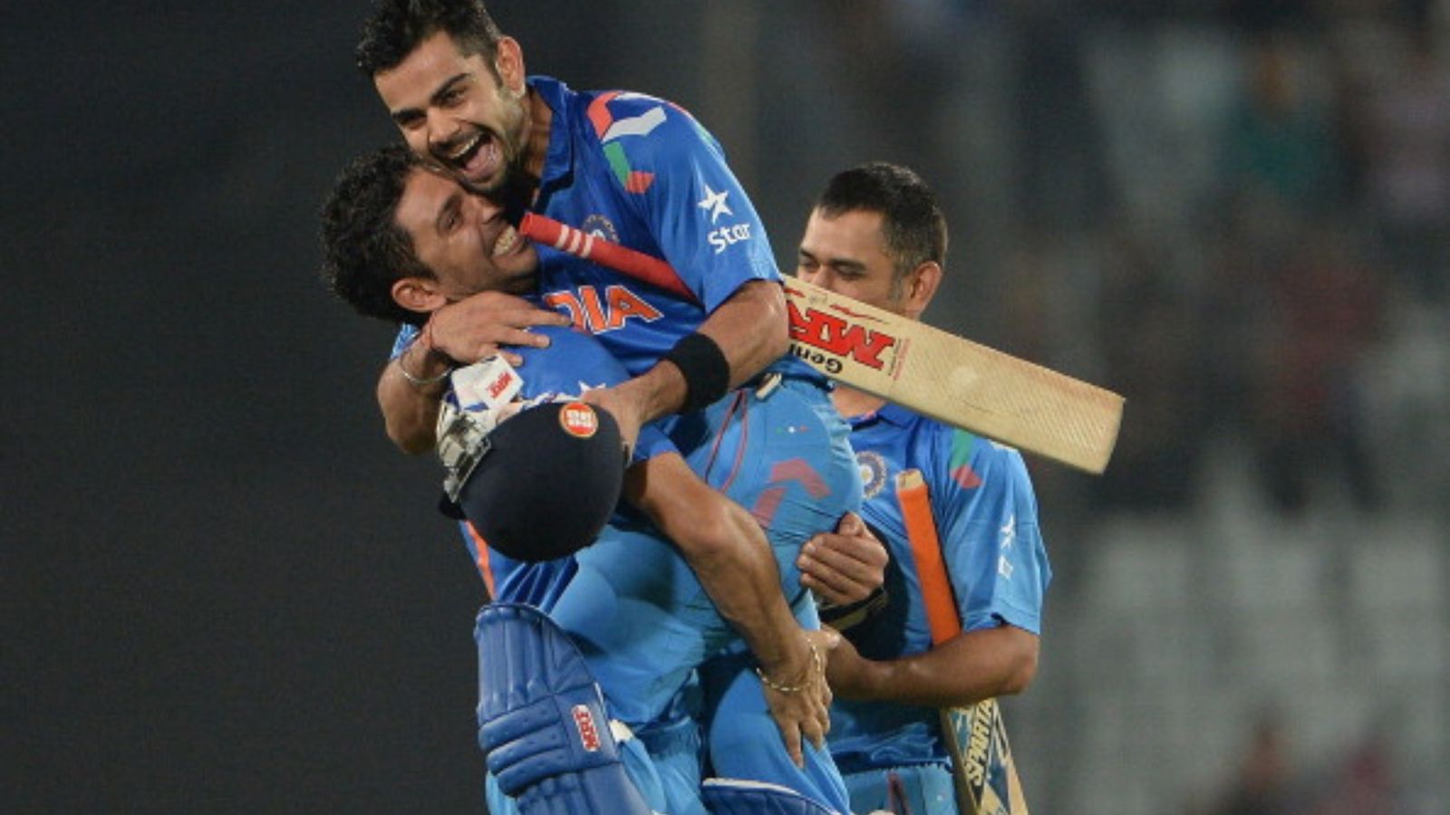 'Virat Kohli's father is smiling at his son from the clouds: Yuvraj Singh shares emotional tribute after record-breaking 50th ODI ton (File Pic) India cricketer Yuvraj Singh picks up teammate Virat Kohli winning a match for his country.
