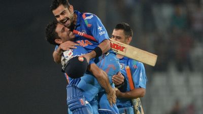 'Virat Kohli's father is smiling at his son from the clouds: Yuvraj Singh shares emotional tribute after record-breaking 50th ODI ton (File Pic) India cricketer Yuvraj Singh picks up teammate Virat Kohli winning a match for his country.