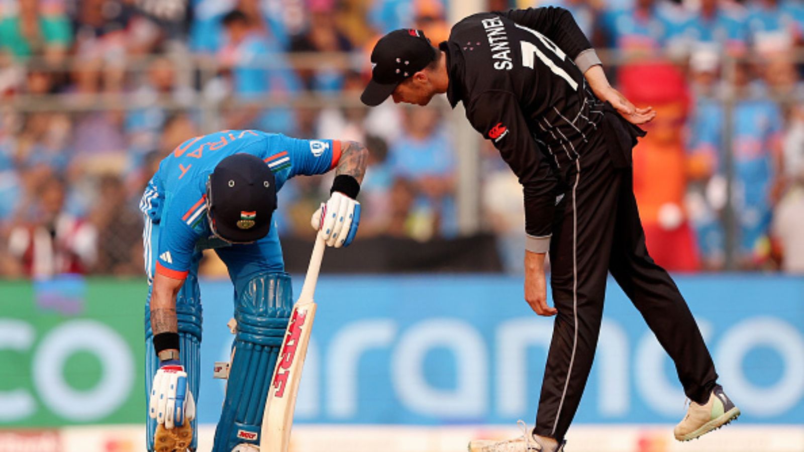 'Why would you help Virat?' Former Australia pacer slams New Zealand for assisting Kohli while he was battling cramps India's Virat Kohli stretches as New Zealand's Mitchell Santner looks on during the ODI World Cup semifinal match at Wankhede Stadium on November 15.