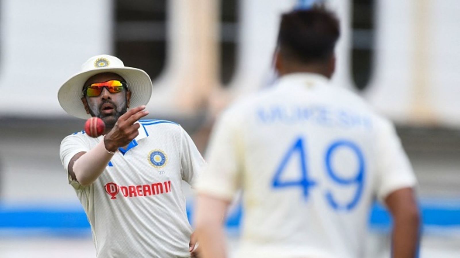‘He could become junior Shami…’: R Ashwin heaps praise on Indian pacer after impressive performance vs Australia in 1st T20I Ravichandran Ashwin (L) throws the ball to Mukesh Kumar (R) of India during the third day of the second Test cricket match between India and West Indies at Queen's Park Oval in Port of Spain, Trinidad and Tobago, July 22, 2023.