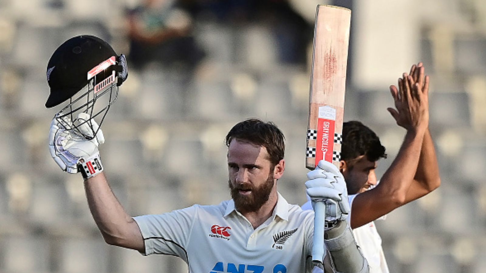 BAN vs NZ: Kane Williamson equals Virat Kohli, Don Bradman's towering Test record with incredible century vs Bangladesh New Zealand's Kane Williamson (L) celebrates after scoring a century during 2nd day of the first Test against Bangladesh on November 29, 2023. (Getty)
