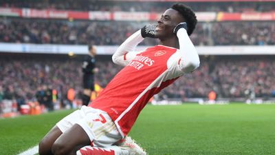 Premier League round-up: Arsenal retain top spot with 2-1 win over Wolves as Manchester United's downfall continues Bukayo Saka celebrates scoring during the Premier League match between Arsenal and Wolverhampton Wanderers on December 2.