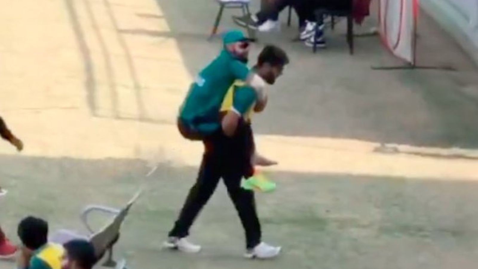 Watch: Injured Pakistan all-rounder Shadab Khan carried off the field 'piggyback style', fans blame PCB for lack of medical facilities Screengrab of Pakistan all-rounder Shadab Khan being lifted off the field after suffering an injury