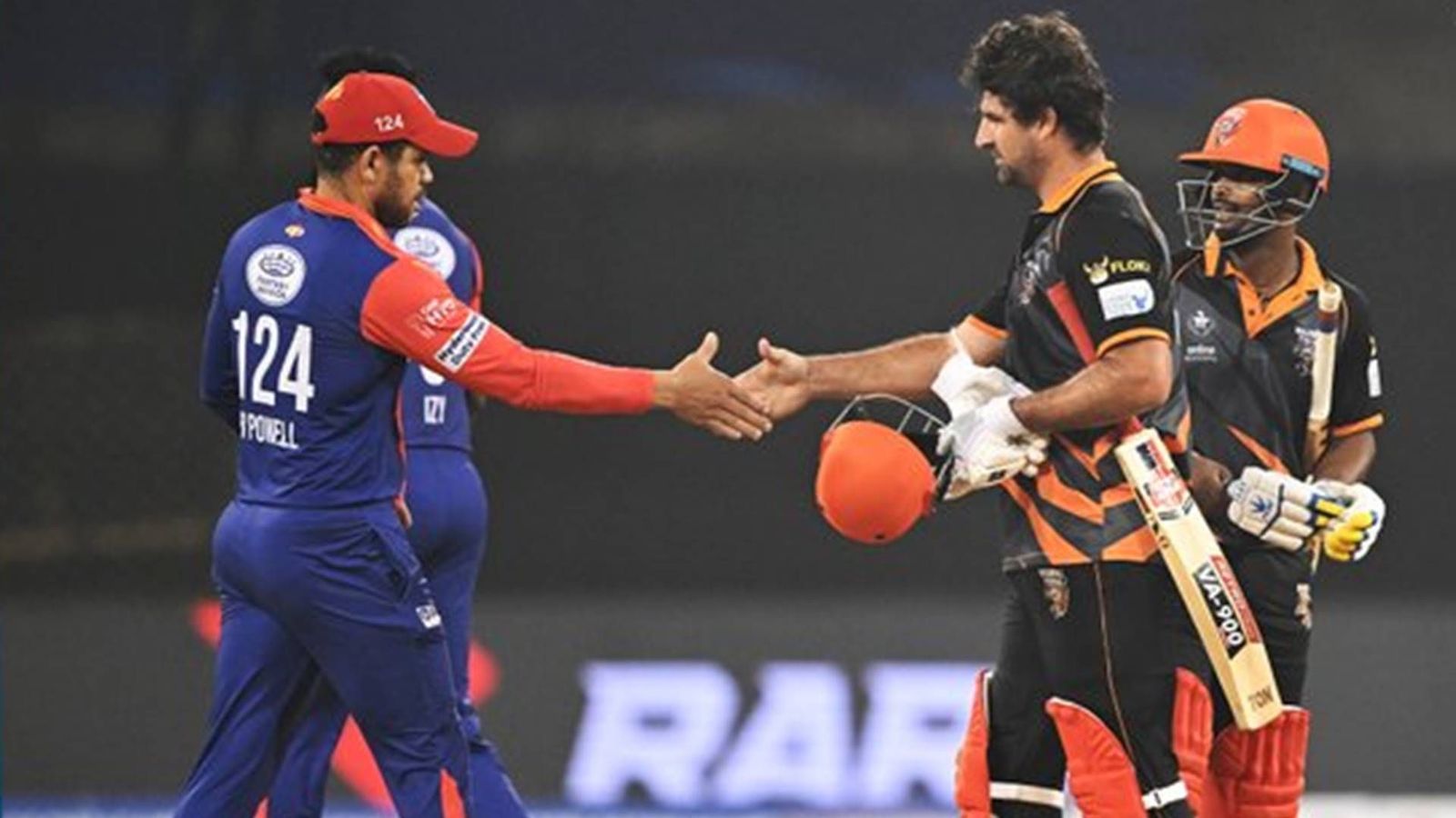 Harbhajan's Manipal Tigers knock Gambhir-led India Capitals to reach LLC 2023 final as Pietersen's fifty goes in vain Colin Grandhomme shakes hands with Ricardo Powell after Manipal Tigers' six-wicket win over India Capitals (Screengrab: LLC, X account)