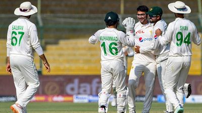 Pakistan's star leg-spinner ruled out of first Test against Australia, off-spinner with 22 wickets from 7 games called up Abrar Ahmed celebrating a wicket with his teammates (Getty Images)
