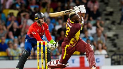 ‘Life is so funny’: Andre Russell reveals he dreamt of getting the 'Player of the Match' award before making T20I return Andre Russell (R) of West Indies hits 6 as Jos Buttler (L) of England watches during the 1st T20I on December 12, 2023. (Getty Images)
