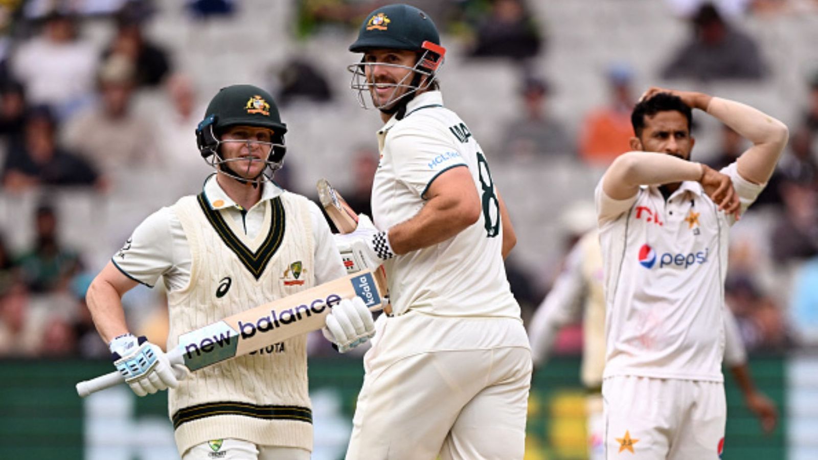 AUS vs PAK: Australia sail ahead on Day 3 after Mitchell Marsh, Steve Smith smack contrasting half-centuries Steve Smith (L) and Mitch Marsh (C) take runs from Pakistan bowler Hasan Ali (R).