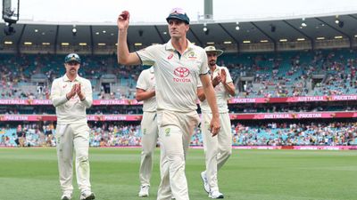 AUS vs PAK: Pat Cummins packs a punch once again, kick-starts new year with another five-wicket haul Pat Cummins of Australia holds up the ball as he leaves the field.