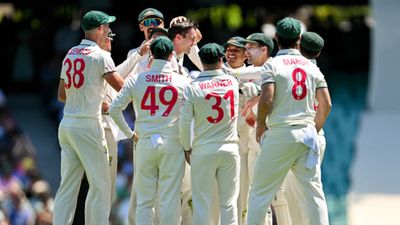 Michael Vaughan snubs David Warner, Steve Smith to declare this player as Australia's greatest cricketer after Bradman Australia skipper Pat Cummins celebrates with his teammates after taking the wicket of Babar Azam during Day 1 of the third Test against Pakistan. (Getty)