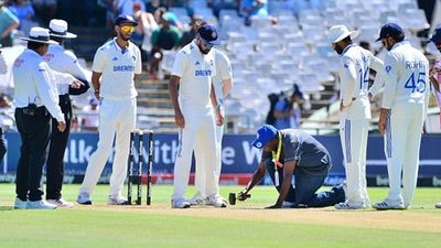 ICC reveals rating for bouncy Newlands pitch which witnessed shortest Test match, hands one demerit point Indian players and umpires at Newlands, Cape Town as groundsman does repair work (Getty Images)