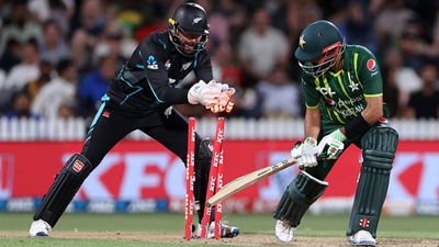 Babar Azam and Fakhar Zaman's fifties in vain as Pakistan suffer another batting collapse in run chase against New Zealand Devon Conway takes off the bails after Babar Azam misses the ball (Getty Images)